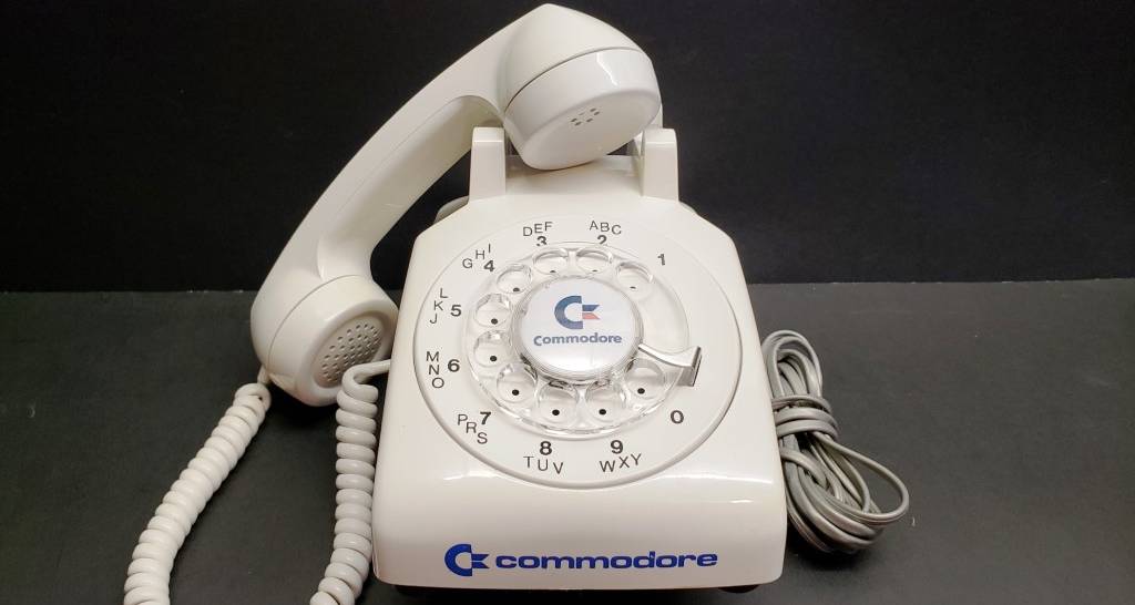 A Commodore branded rotary phone.