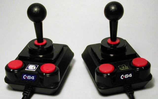 Two classic-looking computer joysticks