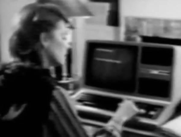 A mother using a TRS-80.